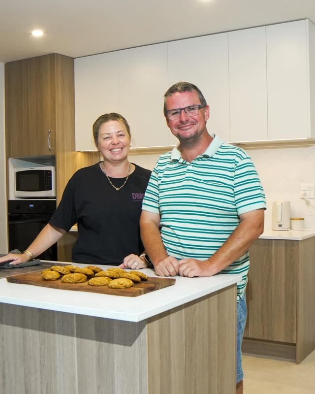 Dream Maker support worker and participant in the kitchen with freshly baked biscuits