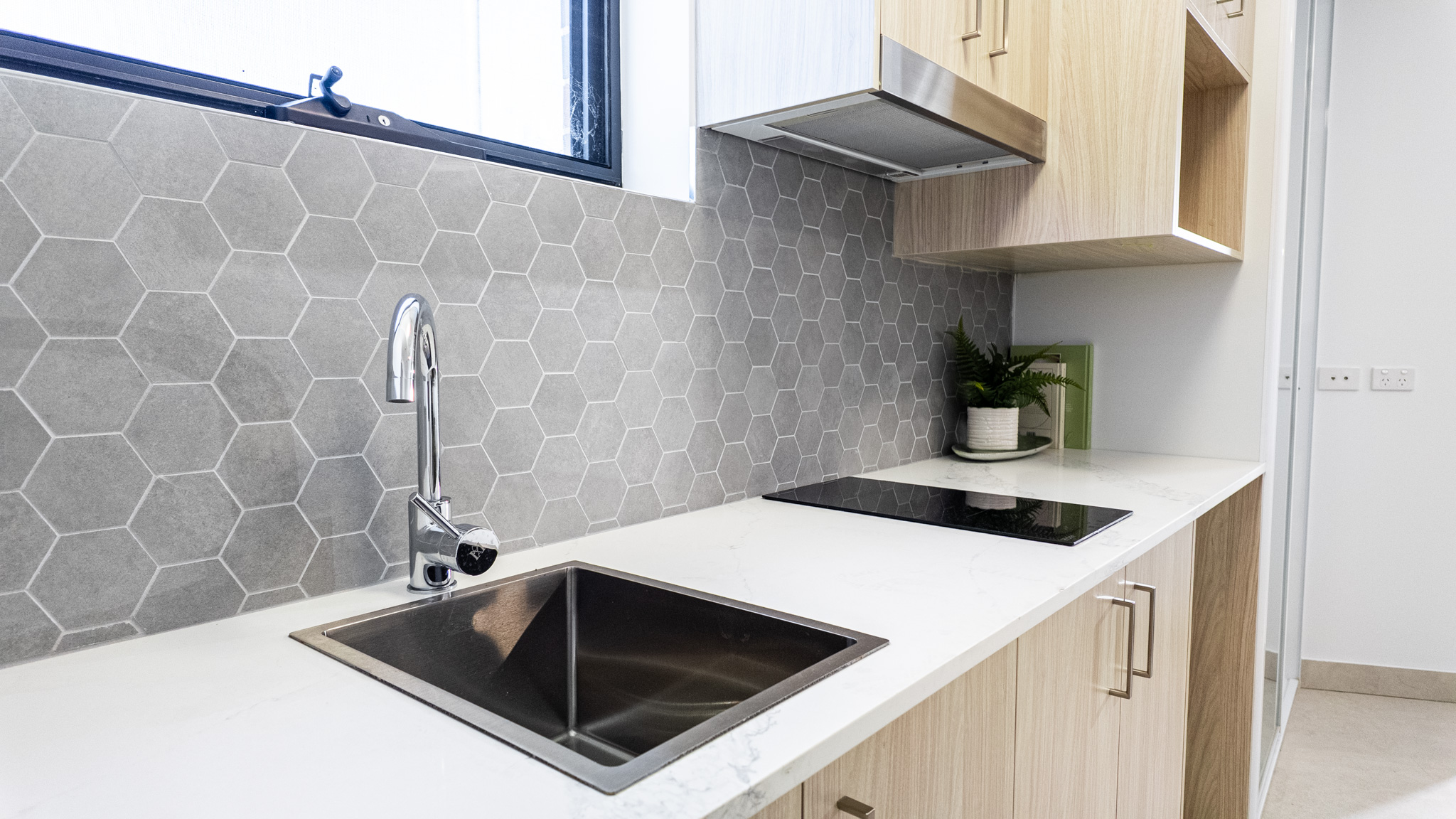 Rooty Hill SIL Apartments - kitchen sink and cooktop