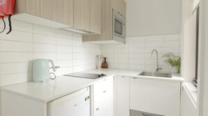 Leumeah SIL housing - kitchen with cooktop, sink and microwave