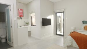 Leumeah SIL housing - studio apartment with kitchenette and balcony door